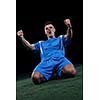 soccer player doing kick with ball on football stadium  field  isolated on black background
