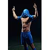 soccer player doing kick with ball on football stadium  field  isolated on black background