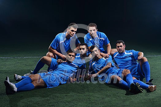 soccer players team group celebrating the victory and become champion of game while holding win coup soccer players team group celebrating the victory and become champion of game while holding win coup