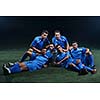 soccer players team group celebrating the victory and become champion of game while holding win coup