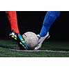 soccer player doing kick with ball on football stadium  field  isolated on black background