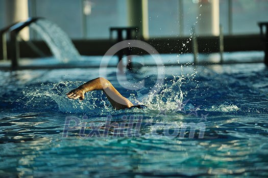 health and fitness lifestyle concept with young athlete swimmer recreating on olimpic pool health and fitness lifestyle concept with young athlete swimmer recreating on olimpic pool