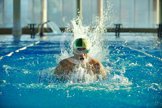 health and fitness lifestyle concept with young athlete swimmer recreating on olimpic pool health and fitness lifestyle concept with young athlete swimmer recreating on olimpic pool