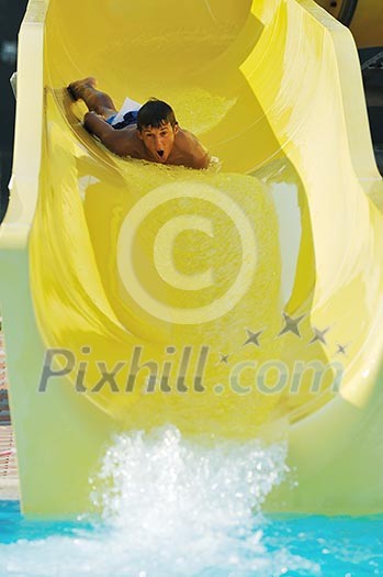 happy child have fun on water slike on outdoor swimming pool happy child have fun on water slike on outdoor swimming pool