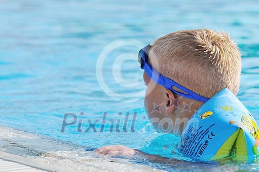 happy kids have fun on outdoor swimming pool at beautiful aquapark happy kids have fun on outdoor swimming pool at beautiful aquapark