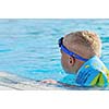 happy kids have fun on outdoor swimming pool at beautiful aquapark