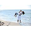 happy young couple in white clothing  have romantic recreation and   fun at beautiful beach on  vacations