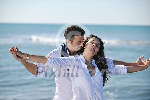 happy young couple in white clothing have romantic recreation and fun at beautiful beach on vacations happy young couple in white clothing have romantic recreation and fun at beautiful beach on vacations