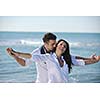 happy young couple in white clothing  have romantic recreation and   fun at beautiful beach on  vacations