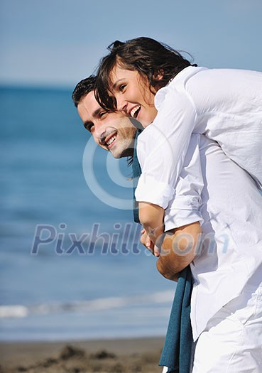 happy young couple in white clothing have romantic recreation and fun at beautiful beach on vacations happy young couple in white clothing have romantic recreation and fun at beautiful beach on vacations