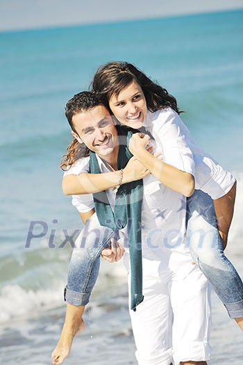 happy young couple in white clothing have romantic recreation and fun at beautiful beach on vacations happy young couple in white clothing have romantic recreation and fun at beautiful beach on vacations