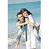 happy young couple in white clothing  have romantic recreation and   fun at beautiful beach on  vacations
