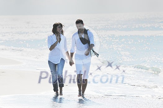 happy young couple in white clothing have romantic recreation and fun at beautiful beach on vacations happy young couple in white clothing have romantic recreation and fun at beautiful beach on vacations
