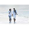 happy young couple in white clothing  have romantic recreation and   fun at beautiful beach on  vacations