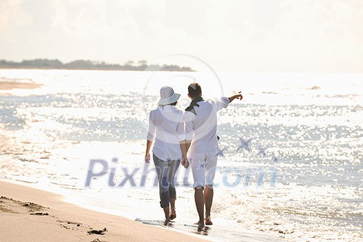 happy young couple in white clothing have romantic recreation and fun at beautiful beach on vacations happy young couple in white clothing have romantic recreation and fun at beautiful beach on vacations