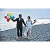 happy just married young couple celebrating and have fun at beautiful beach sunset