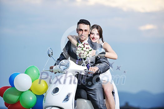 wedding sce of bride and groom just married couple on the beach ride white scooter and have fun wedding sce of bride and groom just married couple on the beach ride white scooter and have fun