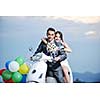 wedding sce of bride and groom just married couple on the beach ride white scooter and have fun
