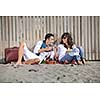 happy young couple enjoying  picnic on the beach and have good time on summer vacations