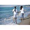 happy young couple in white clothing  have romantic recreation and   fun at beautiful beach on  vacations
