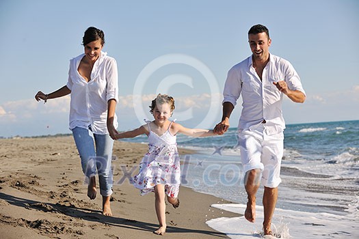 happy young family in white clothing have fun at vacations on beautiful beach happy young family in white clothing have fun at vacations on beautiful beach