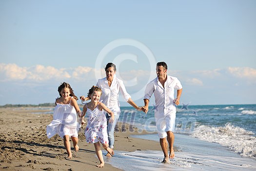 happy young family in white clothing have fun at vacations on beautiful beach happy young family in white clothing have fun at vacations on beautiful beach