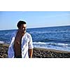young man have good time and relax at beautifu beach at seaside