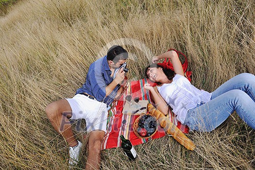 happy young couple relaxing in nature white making photos and taking images and posing for camera happy young couple relaxing in nature white making photos and taking images and posing for camera