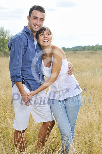 happy young couple have romantic time outdoor while smiling and hug happy young couple have romantic time outdoor while smiling and hug