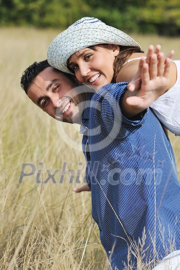 happy young couple have romantic time outdoor while smiling and hug happy young couple have romantic time outdoor while smiling and hug
