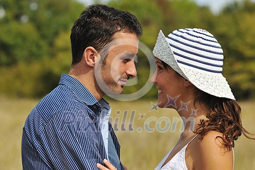 happy young couple have romantic time outdoor while smiling and hug happy young couple have romantic time outdoor while smiling and hug