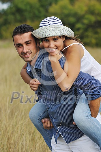 happy young couple have romantic time outdoor while smiling and hug happy young couple have romantic time outdoor while smiling and hug