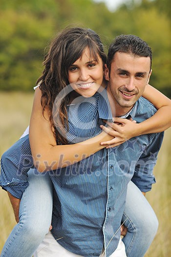happy young couple have romantic time outdoor while smiling and hug happy young couple have romantic time outdoor while smiling and hug