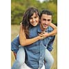 happy young couple have romantic time outdoor while smiling and hug