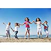 happy young people group have fun  run and jump  on beach beautiful sand  beach