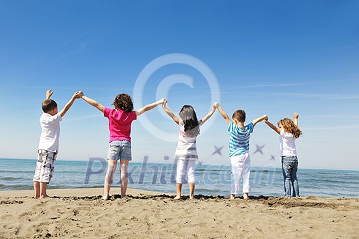 happy young people group have fun run and jump on beach beautiful sand beach happy young people group have fun run and jump on beach beautiful sand beach