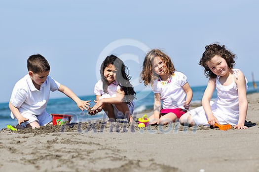 happy child kids have fun and play games on beach happy child kids have fun and play games on beach