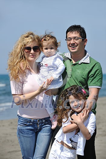 happy young family have fun and live healthy lifestyle on beach happy young family have fun and live healthy lifestyle on beach