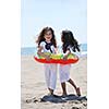 happy young people group have fun  run and jump  on beach beautiful sand  beach