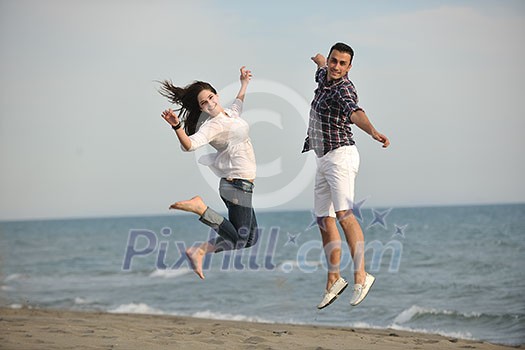 happy young couple have fun and romantic moments on beach at summer season and representing happynes and travel concept happy young couple have fun and romantic moments on beach at summer season and representing happynes and travel concept