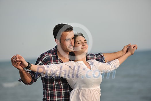 happy young couple have fun and romantic moments on beach at summer season and representing happynes and travel concept happy young couple have fun and romantic moments on beach at summer season and representing happynes and travel concept