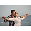 happy young couple have fun and romantic moments on beach at summer season and representing happynes and travel concept