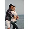 happy young couple have fun and romantic moments on beach at summer season and representing happynes and travel concept