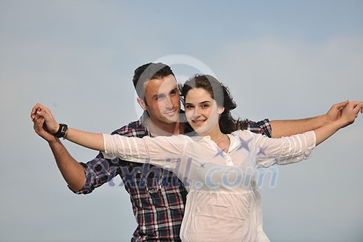happy young couple have fun and romantic moments on beach at summer season and representing happynes and travel concept happy young couple have fun and romantic moments on beach at summer season and representing happynes and travel concept