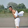 young man relax and have fun on beach at summer time