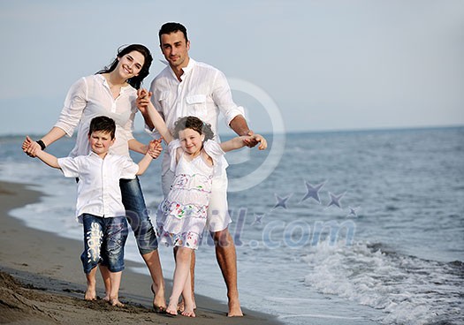 happy young family have fun and live healthy lifestyle on beach happy young family have fun and live healthy lifestyle on beach