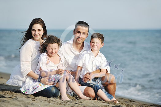 happy young family have fun and live healthy lifestyle on beach happy young family have fun and live healthy lifestyle on beach