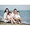 happy young family have fun and live healthy lifestyle on beach