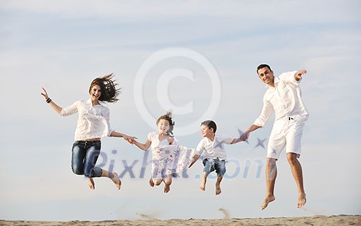 happy young family have fun and live healthy lifestyle on beach happy young family have fun and live healthy lifestyle on beach
