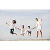 happy young family have fun and live healthy lifestyle on beach